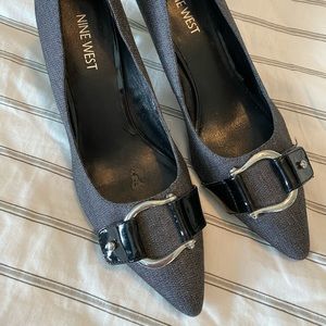 Nine West gray and black heels with buckle detail.